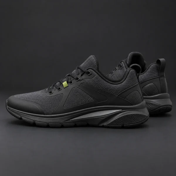 Charcoal trainers with sculpted black soles and reflective inserts